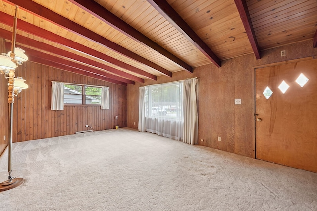 214 Hickory Ln, Momence, IL 60954 - unfurnished living room with carpet, a wooden ceiling with exposed beams, and wooden walls