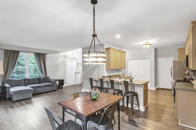 2451 Stonegate Rd Unit 2451, Algonquin, IL 60102 - dining room with wood finished floors, baseboards, and recessed lighting