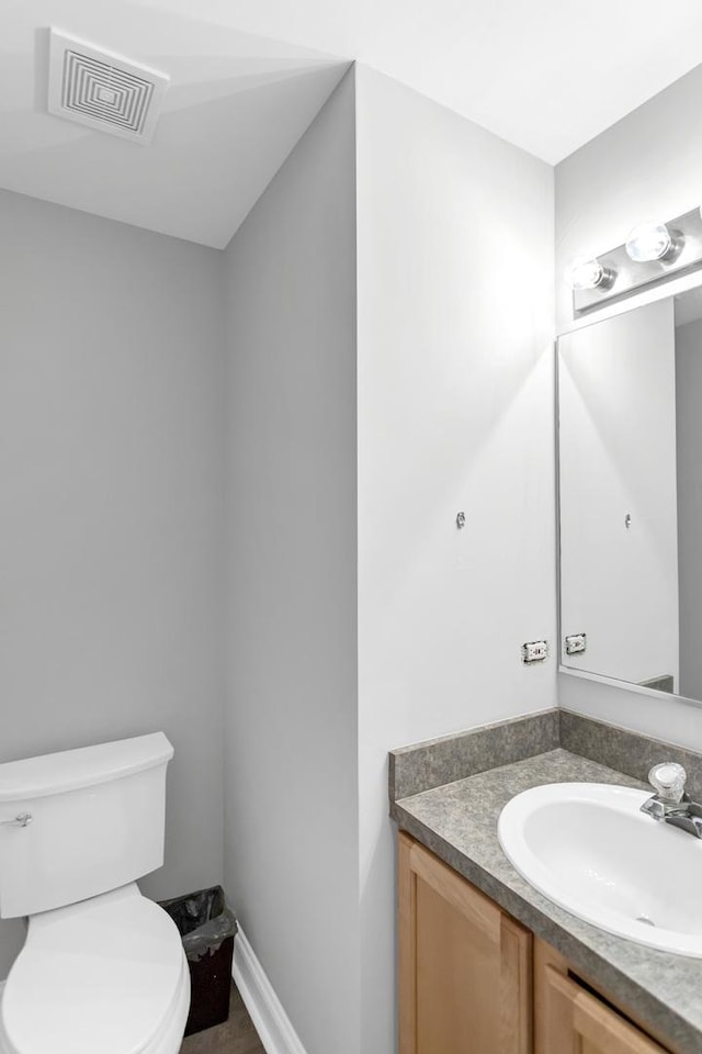 2451 Stonegate Rd Unit 2451, Algonquin, IL 60102 - bathroom with vanity, toilet, and baseboards
