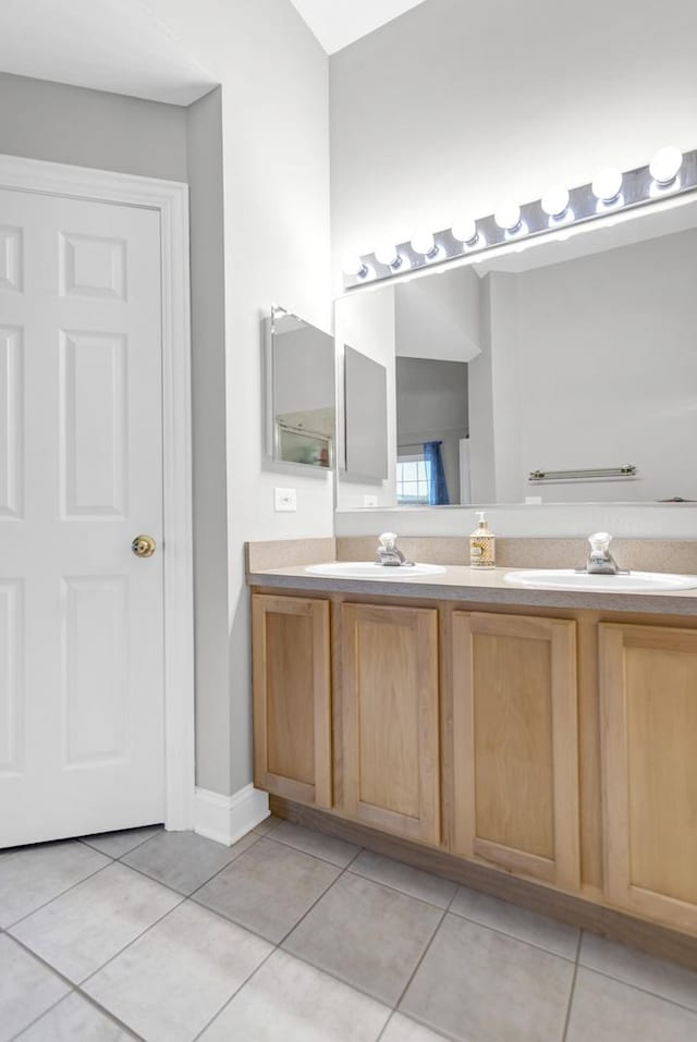 2451 Stonegate Rd Unit 2451, Algonquin, IL 60102 - full bath with double vanity, tile patterned floors, and baseboards