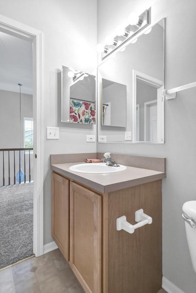 2451 Stonegate Rd Unit 2451, Algonquin, IL 60102 - bathroom featuring vanity, toilet, and baseboards
