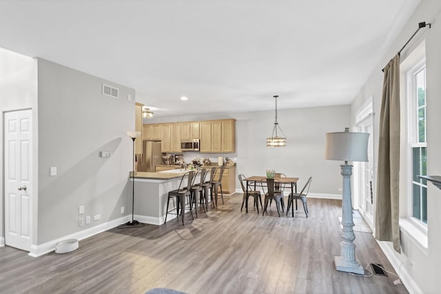 2451 Stonegate Rd Unit 2451, Algonquin, IL 60102 - dining area featuring wood finished floors, baseboards, and recessed lighting
