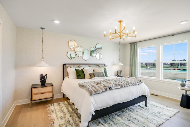 23244 W Teton Ln, Plainfield, IL 60585 - bedroom featuring a chandelier, light wood finished floors, baseboards, and recessed lighting