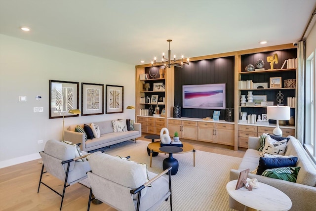 23244 W Teton Ln, Plainfield, IL 60585 - living room with light wood-type flooring, a chandelier, recessed lighting, built in shelves, and baseboards