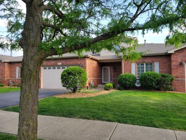 11151 188th Pl, Mokena, IL 60448 - view of front of property featuring driveway, a front lawn, brick siding, and an attached garage