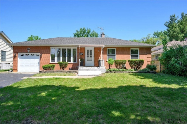 215 S Forest Ave, Palatine, IL 60074 - ranch-style house with a garage, asphalt driveway, a chimney, and brick siding