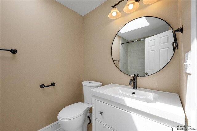 215 S Forest Ave, Palatine, IL 60074 - bathroom with vanity, toilet, and baseboards