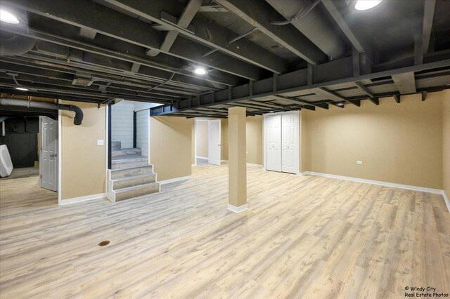 215 S Forest Ave, Palatine, IL 60074 - finished basement featuring stairs, baseboards, and wood finished floors