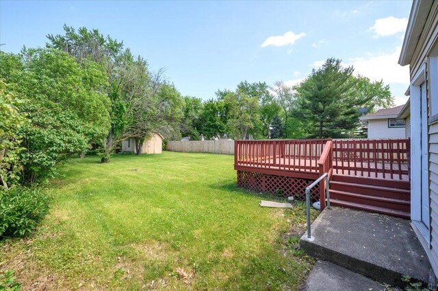 215 S Forest Ave, Palatine, IL 60074 - view of yard featuring a storage unit, a wooden deck, and an outdoor structure