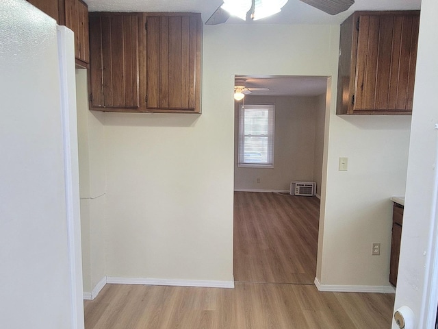 1211 S Clayton St, Bloomington, IL 61701 - kitchen featuring ceiling fan, light wood finished floors, baseboards, and light countertops