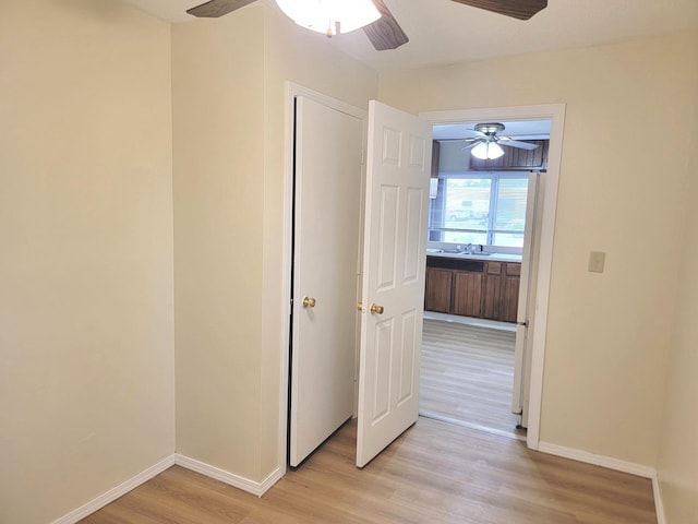 1211 S Clayton St, Bloomington, IL 61701 - hall with light wood-style floors and baseboards