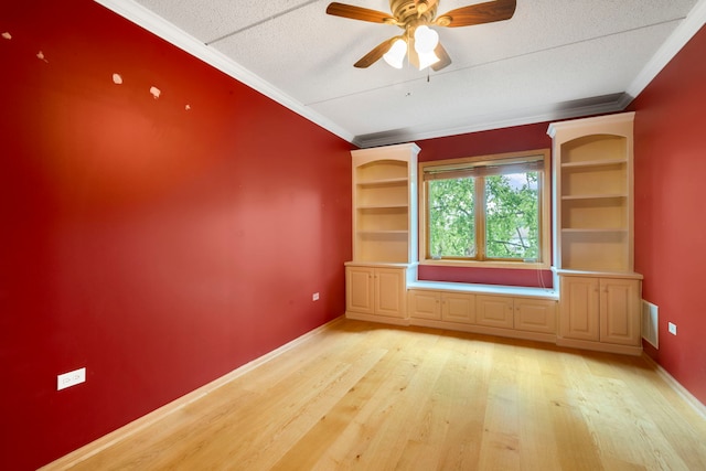 100 N Gary Ave N Unit 304, Wheaton, IL 60187 - spare room featuring light wood finished floors, ornamental molding, a ceiling fan, and a textured ceiling
