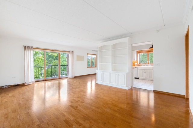 100 N Gary Ave N Unit 304, Wheaton, IL 60187 - unfurnished living room featuring healthy amount of natural light and light wood-style flooring