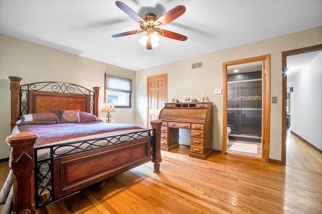 1016 W Willow Ln, Mount Prospect, IL 60056 - bedroom with light wood-type flooring, ensuite bathroom, baseboards, and a ceiling fan