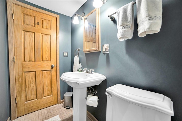 1016 W Willow Ln, Mount Prospect, IL 60056 - half bathroom featuring toilet and baseboards