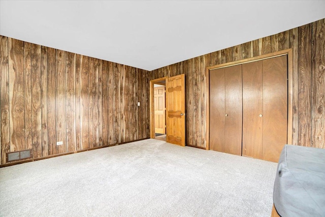 1016 W Willow Ln, Mount Prospect, IL 60056 - bedroom featuring wooden walls, carpet floors, and a closet