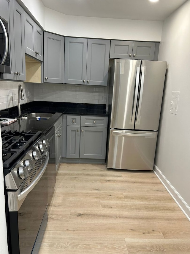 8521 Lotus Ave Unit 706, Skokie, IL 60077 - kitchen with stainless steel appliances, gray cabinetry, and a sink