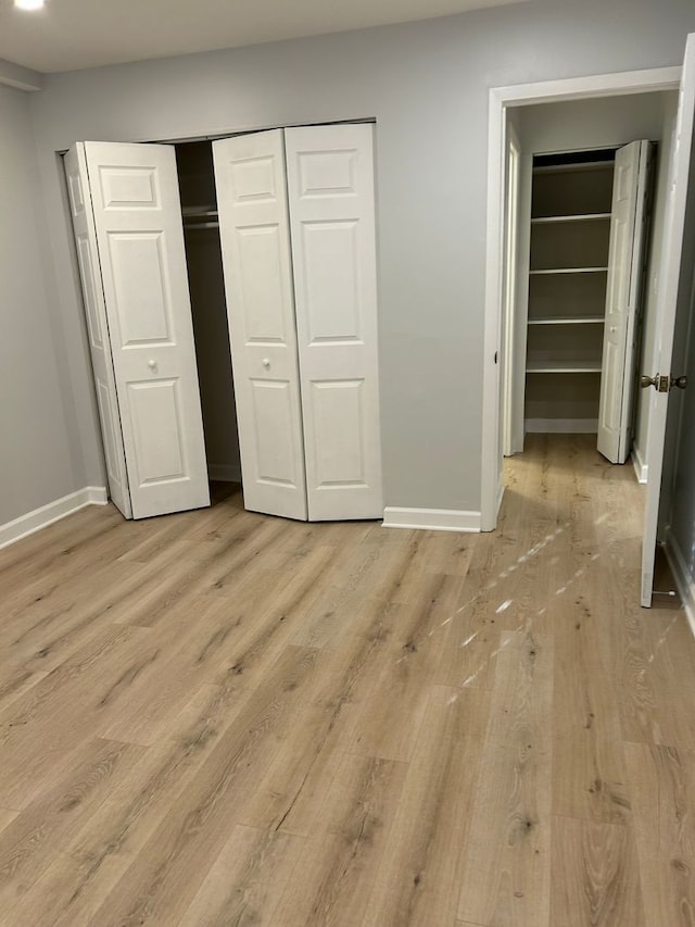 8521 Lotus Ave Unit 706, Skokie, IL 60077 - unfurnished bedroom with light wood-type flooring and baseboards