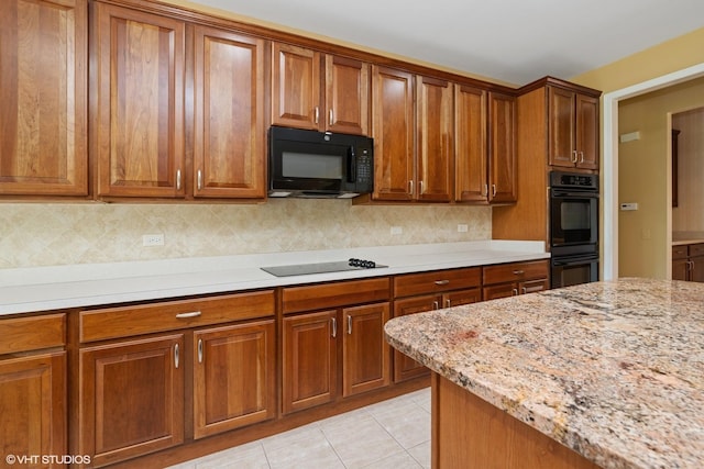 13881 Traverse Ct, Huntley, IL 60142 - kitchen featuring black appliances and brown cabinetry