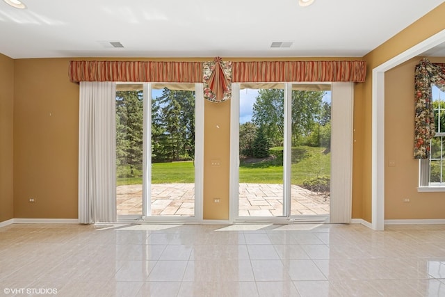 13881 Traverse Ct, Huntley, IL 60142 - doorway to outside with baseboards and tile patterned flooring