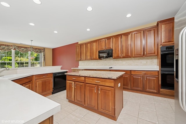 13881 Traverse Ct, Huntley, IL 60142 - kitchen with black appliances, a sink, tasteful backsplash, brown cabinets, and light tile patterned floors