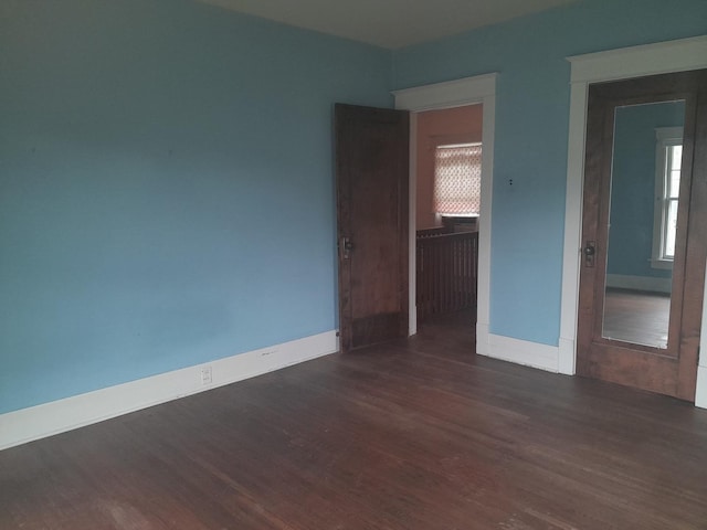516 S Grant St, Earlville, IL 60518 - empty room featuring wood finished floors and baseboards