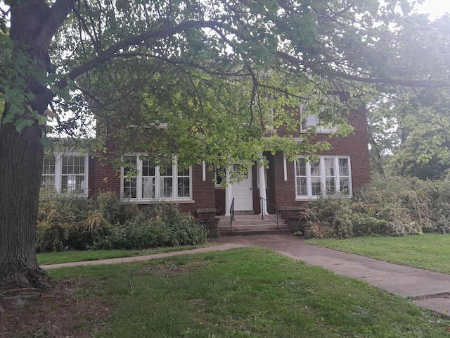 516 S Grant St, Earlville, IL 60518 - obstructed view of property with a front lawn and brick siding
