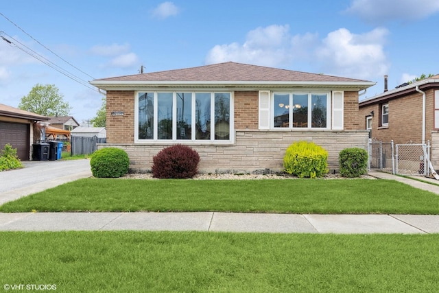 12746 S Marquette Ave, Chicago, IL 60633 - view of front facade with brick siding, roof with shingles, and stone siding