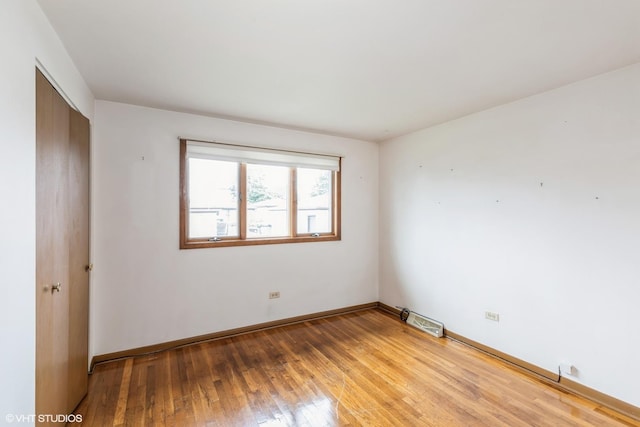 12746 S Marquette Ave, Chicago, IL 60633 - empty room featuring light wood-style floors and baseboards