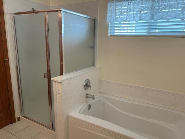 13804 Ironwood Dr, Plainfield, IL 60544 - bathroom featuring a garden tub, a shower stall, and tile patterned floors