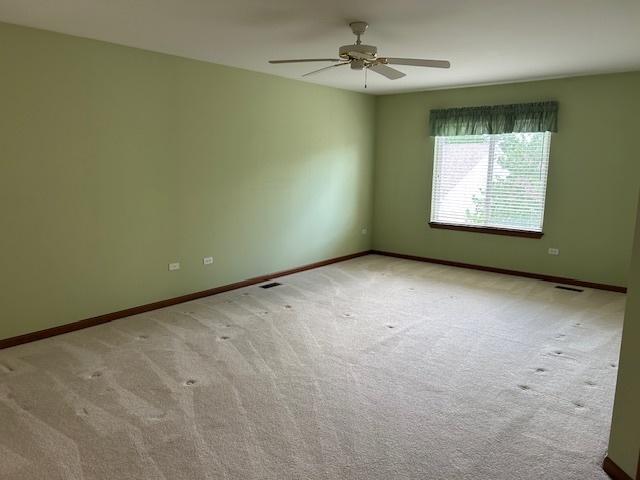 13804 Ironwood Dr, Plainfield, IL 60544 - unfurnished room with carpet flooring, ceiling fan, and baseboards