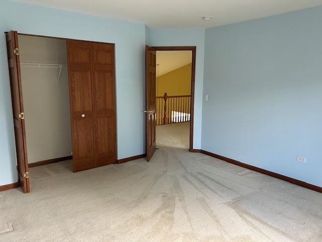 13804 Ironwood Dr, Plainfield, IL 60544 - unfurnished bedroom featuring light colored carpet, a closet, baseboards, and radiator
