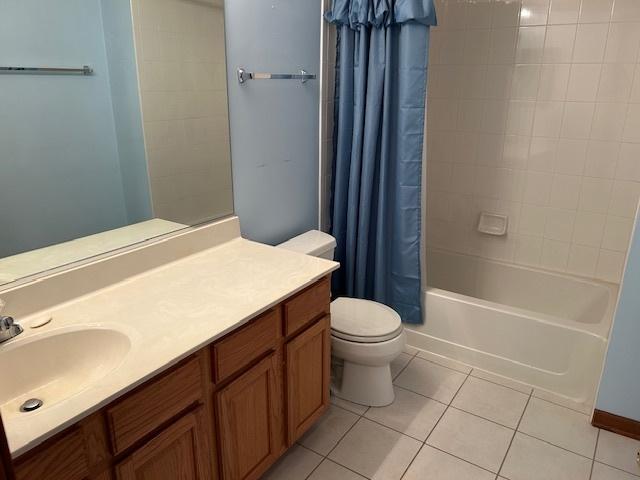 13804 Ironwood Dr, Plainfield, IL 60544 - full bath featuring tile patterned flooring, toilet, vanity, and shower / bath combination with curtain