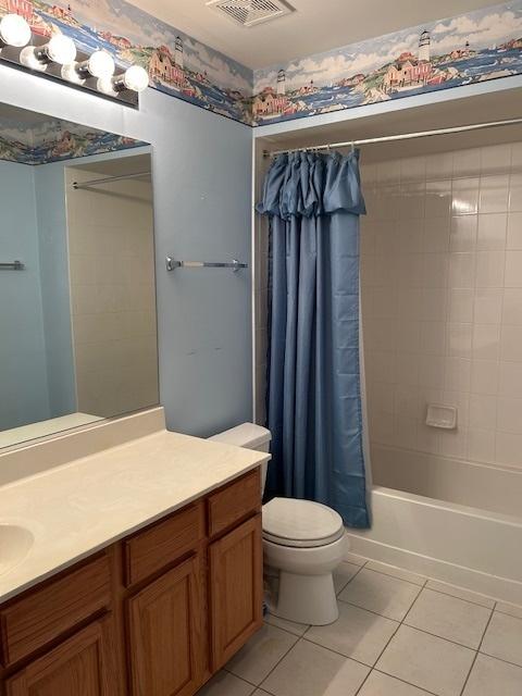 13804 Ironwood Dr, Plainfield, IL 60544 - full bath featuring tile patterned floors, vanity, shower / bath combination with curtain, and toilet