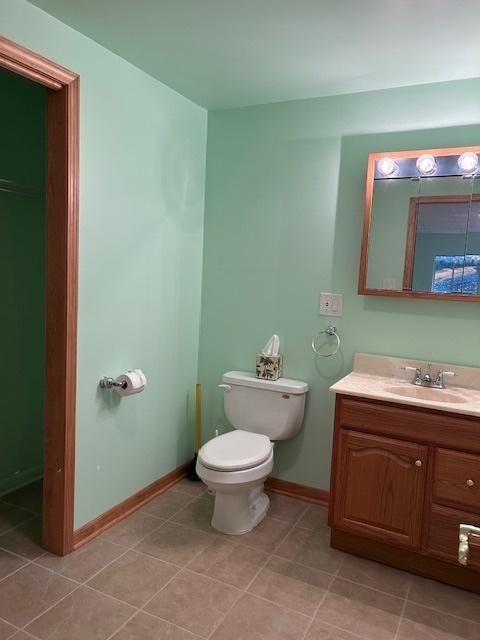 13804 Ironwood Dr, Plainfield, IL 60544 - bathroom featuring vanity, baseboards, toilet, and tile patterned flooring
