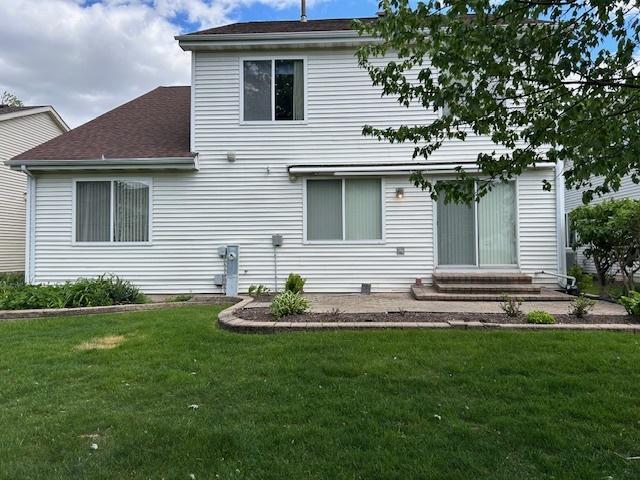 13804 Ironwood Dr, Plainfield, IL 60544 - back of property featuring a yard, entry steps, and a shingled roof