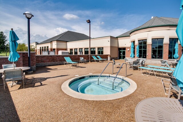 13804 Ironwood Dr, Plainfield, IL 60544 - view of swimming pool with a hot tub and a patio area