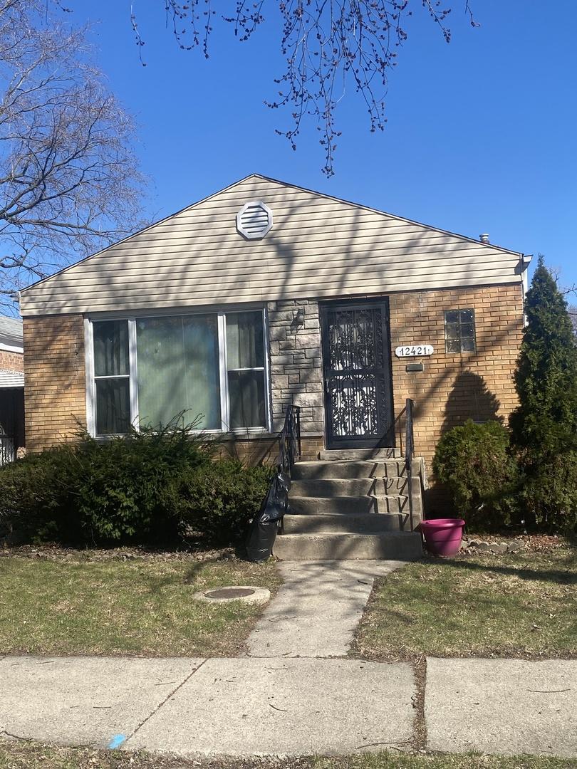 view of front of house featuring brick siding