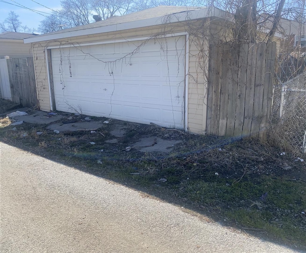 garage with fence
