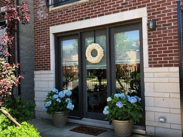6643 W Belmont Ave Unit 1, Chicago, IL 60634 - view of exterior entry featuring brick siding