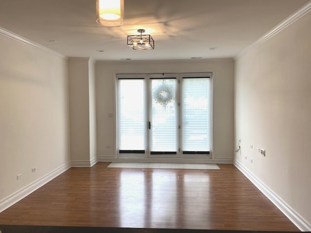 6643 W Belmont Ave Unit 1, Chicago, IL 60634 - unfurnished room featuring wood finished floors, crown molding, and baseboards