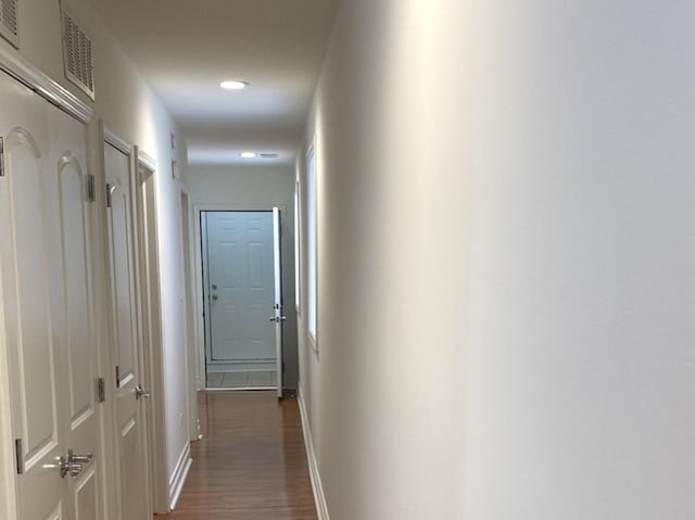 6643 W Belmont Ave Unit 1, Chicago, IL 60634 - hall featuring dark wood finished floors and baseboards