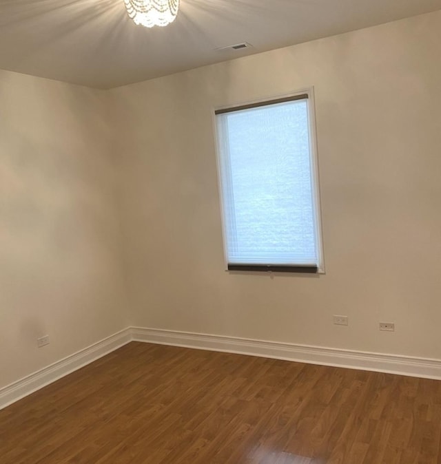 6643 W Belmont Ave Unit 1, Chicago, IL 60634 - unfurnished room with dark wood finished floors and baseboards