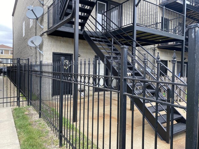6643 W Belmont Ave Unit 1, Chicago, IL 60634 - gate featuring fence and stairway