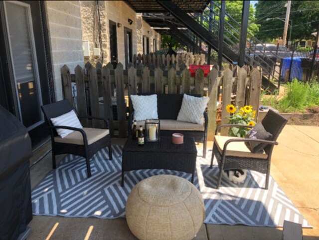 6643 W Belmont Ave Unit 1, Chicago, IL 60634 - view of patio with fence, an outdoor hangout area, and stairs