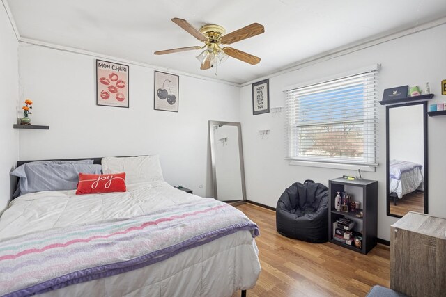7 Woodmar Ct, Streamwood, IL 60107 - bedroom with wood finished floors, a ceiling fan, and ornamental molding