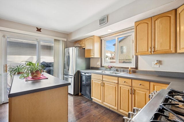 7 Woodmar Ct, Streamwood, IL 60107 - kitchen featuring dishwasher, a sink, healthy amount of natural light, and stainless steel fridge with ice dispenser