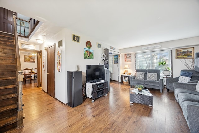7 Woodmar Ct, Streamwood, IL 60107 - living room featuring light wood-style floors and stairway