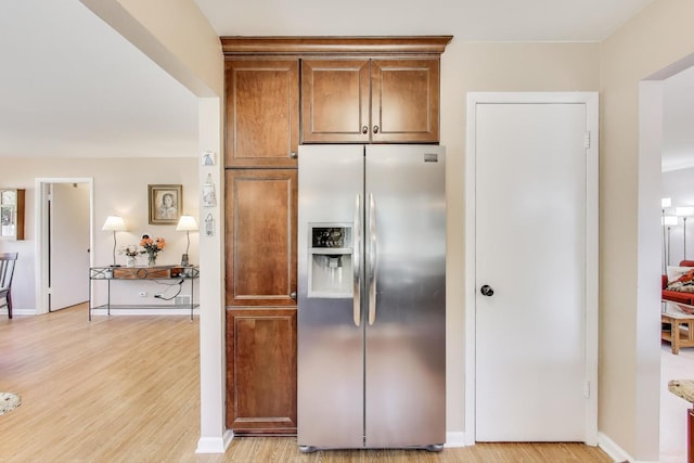609 Bryce Trl, Roselle, IL 60172 - kitchen featuring stainless steel fridge, light wood-style flooring, and baseboards
