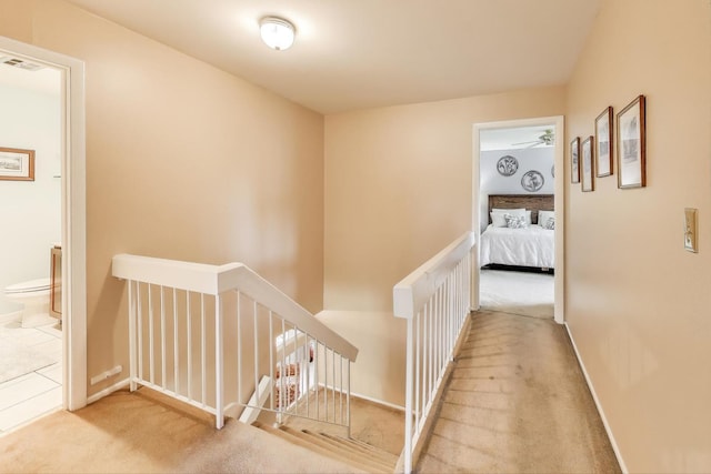 609 Bryce Trl, Roselle, IL 60172 - hallway with an upstairs landing, carpet, and baseboards